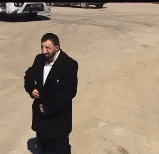 Animated Awkward jacket shuffle GIF Sticker