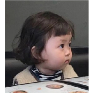 Suspicious toddler glance