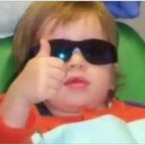 Cool kid with shades giving thumbs up